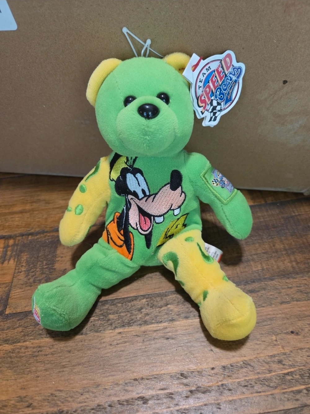 Green & Yellow Plush Bear with Goofy Design